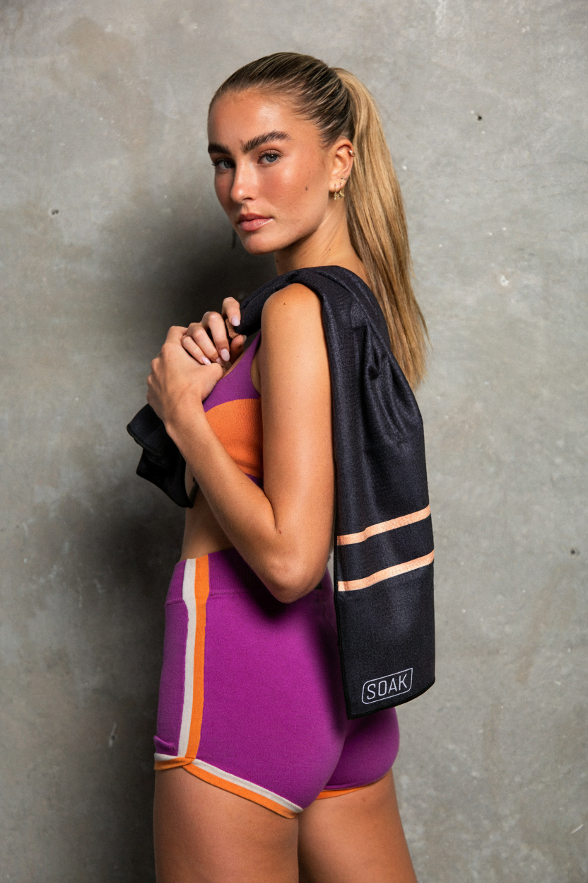 Model front view with outlined logo towel